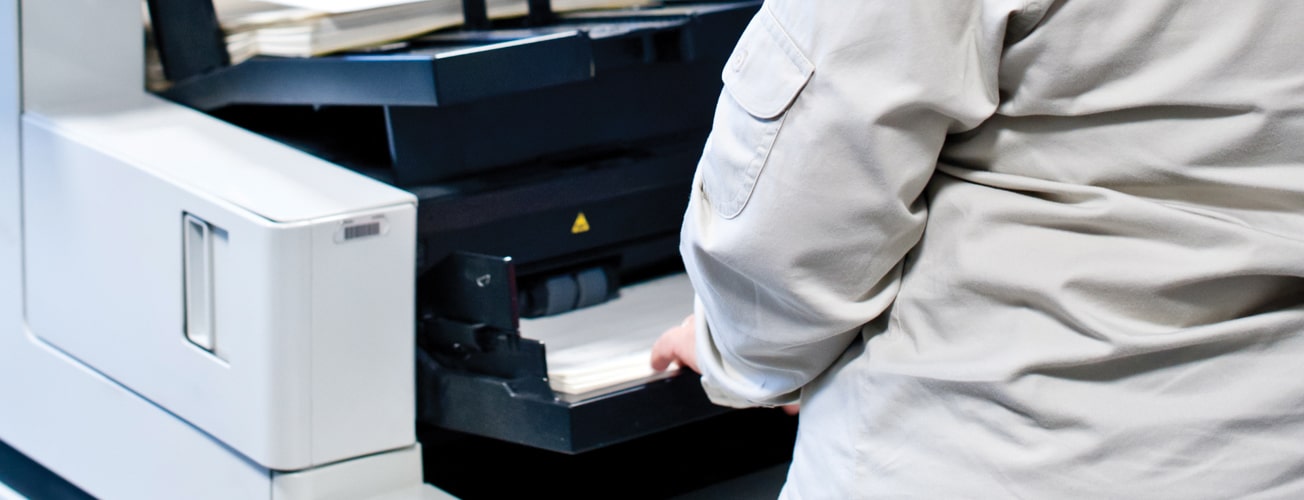 Close-up of employee using scanner
