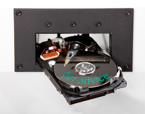 Close-up of a hard drive with 'Our advice' written in green letters