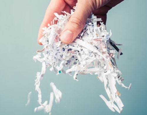 Hand scattering paper shreds