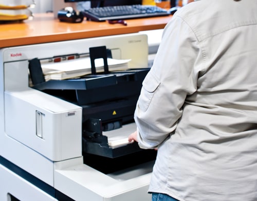 An employee is scanning documents
