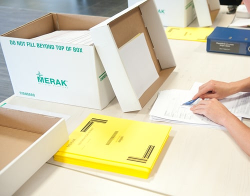 Employees are preparing documents for scanning