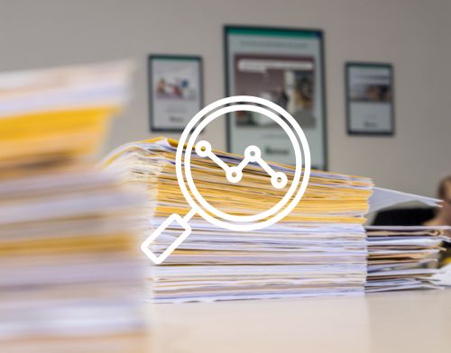 Piles of documents with yellow endpapers between them